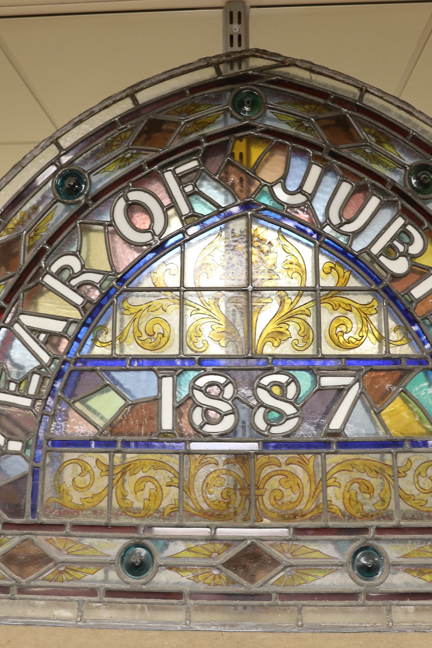 'Year of Jubilee 1887', a Victorian commemorative arched stained glass window, 67x86cm